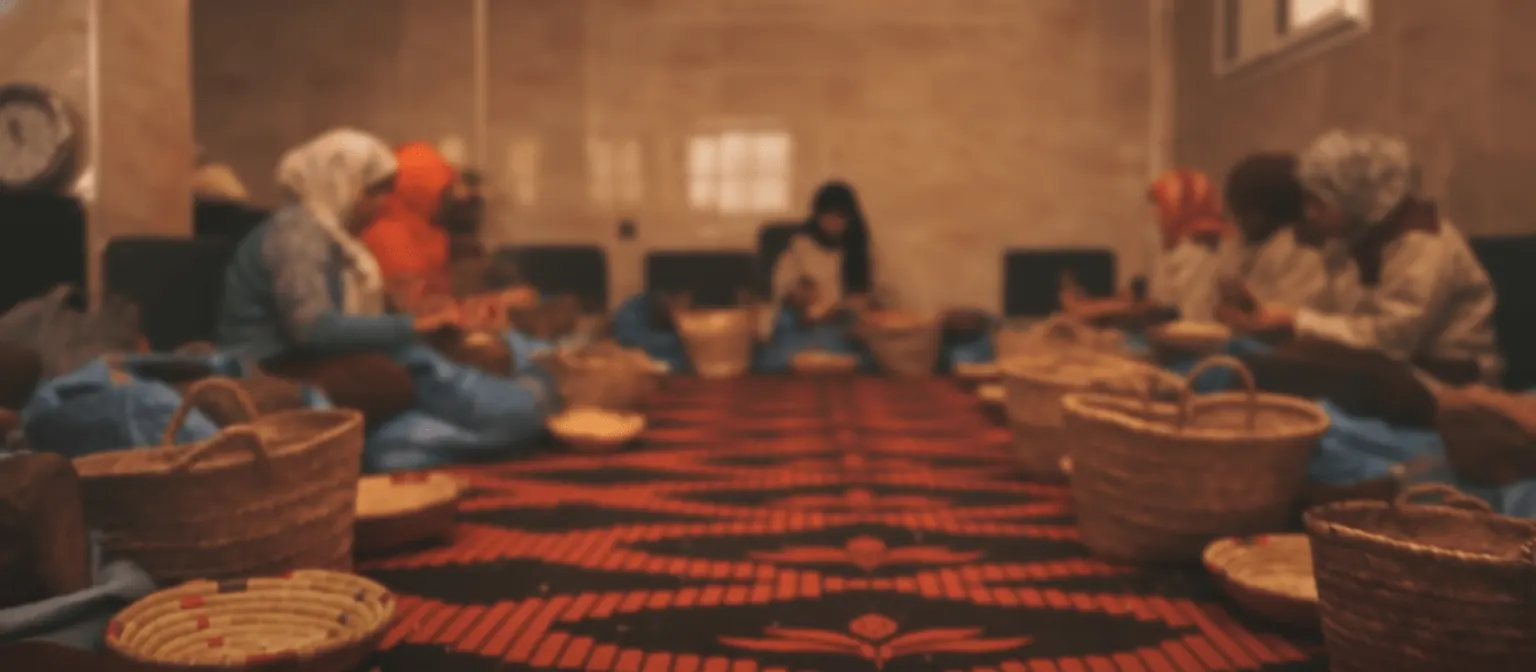 Moroccan women from an Agadir cooperative hand-crafting argan oil
